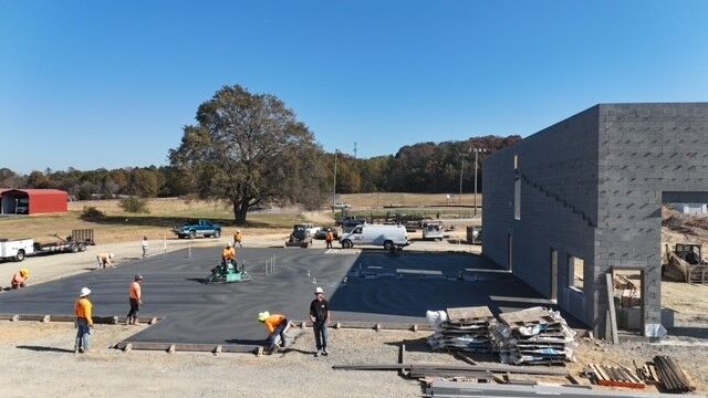 A D.R. Reynolds construction site working on concrete installation.